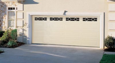 Hurricane Impact Garage Door Installed on tan house