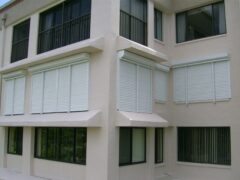 closed rolling shutters on a condo building