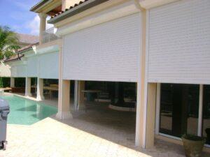 hurricane shutters on a tan house