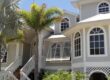 Bahama hurricane shutters over windows of a residential home