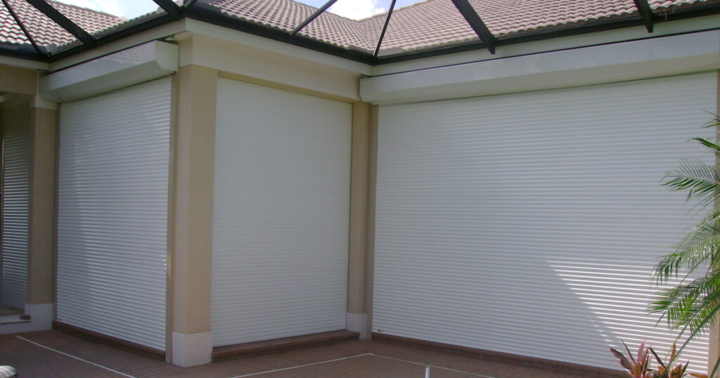 manual roll shutters on tan house fl