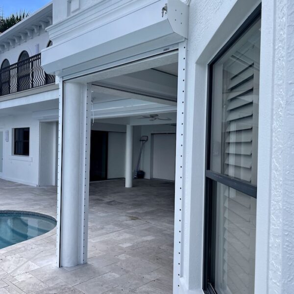 white electric roll down shutters on house in Cape Coral fl