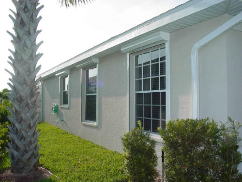 residential security shutters on a home in southwest florida