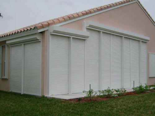 security roll down shutters on peach home in south florida