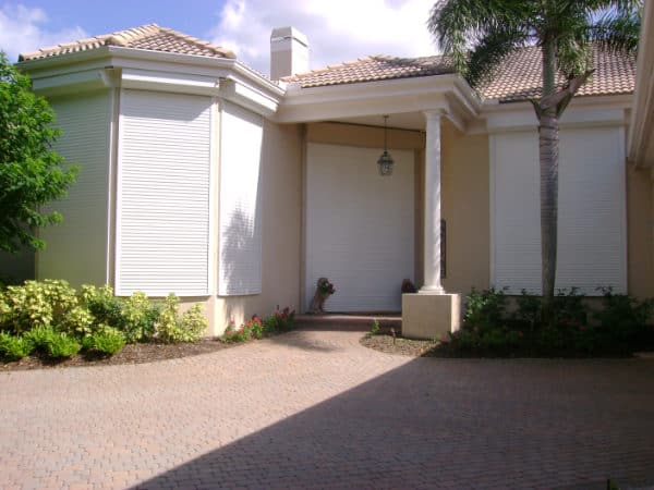Roll down shutters protecting windows of a house in Florida