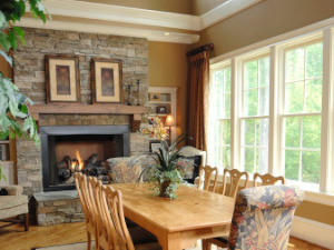 White single-hung impact windows in a tan living room in Florida