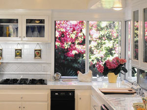 White sliding impact window in a light colored kitchen