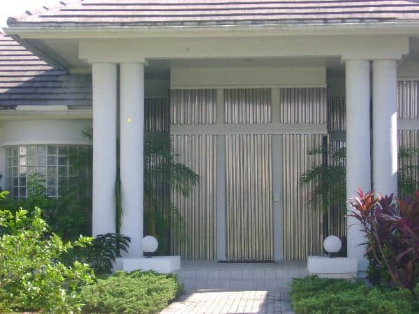 Metal storm panels on a home with pillars.