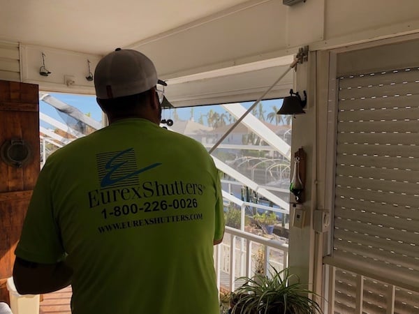 Tommy Tessner repairing roll down hurricane shutters in Fort Myers Beach days after Hurricane Ian hit Southwest Florida.