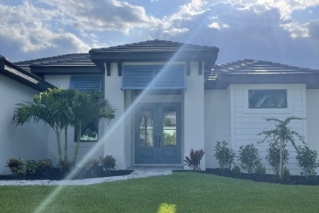 Blue Deco Bahama shutters shown on a home in Cape Coral Florida.