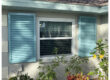 Blue Colonial hurricane shutters installed on a home in Venice Florida
