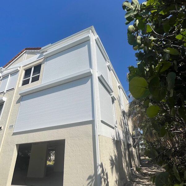White roll up shutters installed on a home in Sanibel Island FL