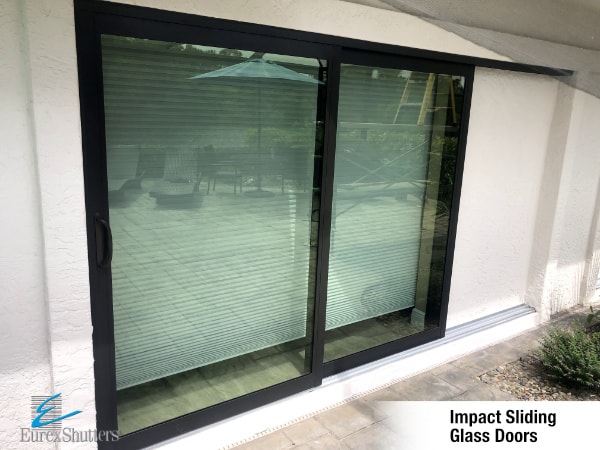 Eurex Shutters impact sliding door installation with aluminum frames. 