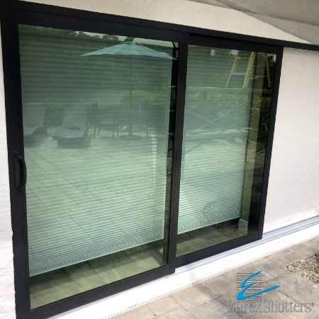 Impact sliding patio door with aluminum frames and impact glass