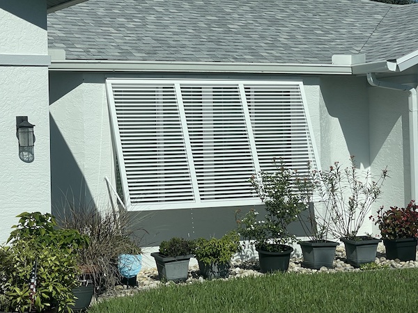 Custom louvered Bahama storm shutters