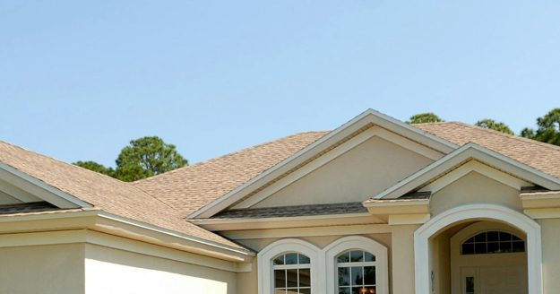 Asphalt shingle roof on a tan home in Florida