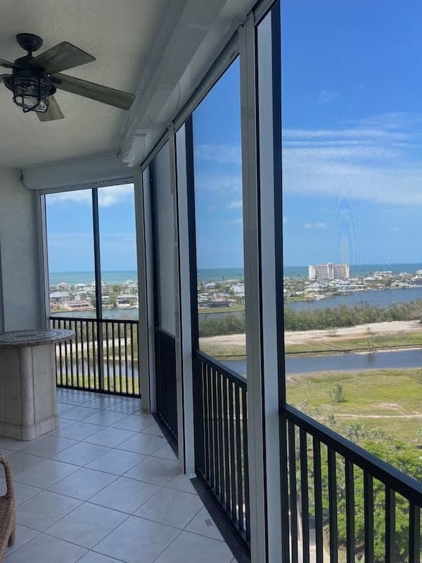 Roll shutters installed on the inside of balcony openings of a condo. 