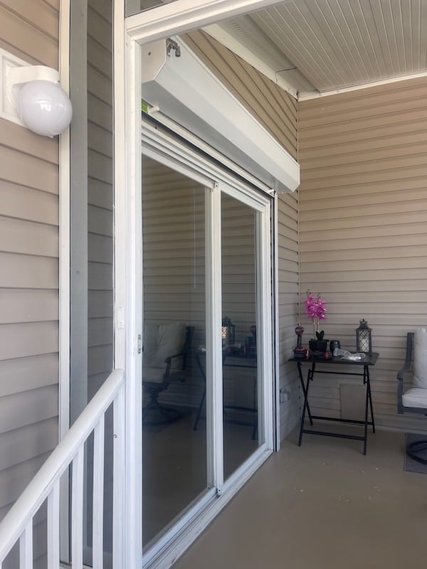 roll shutters shown in the open position over a double sliding door